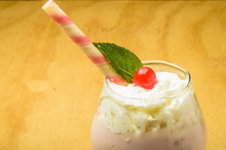 frothed milk with cherry and waffle