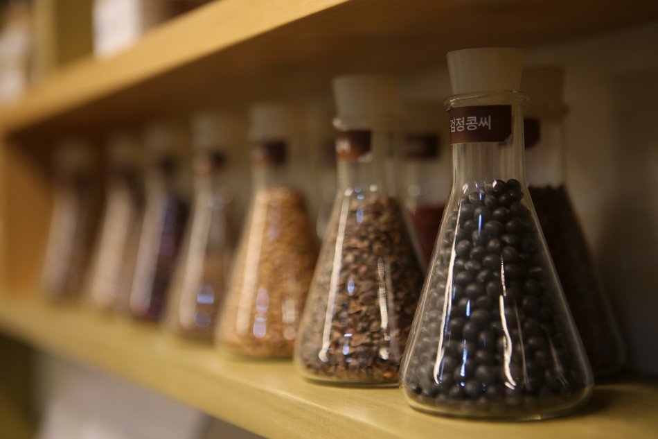 seeds and beans in bottles
