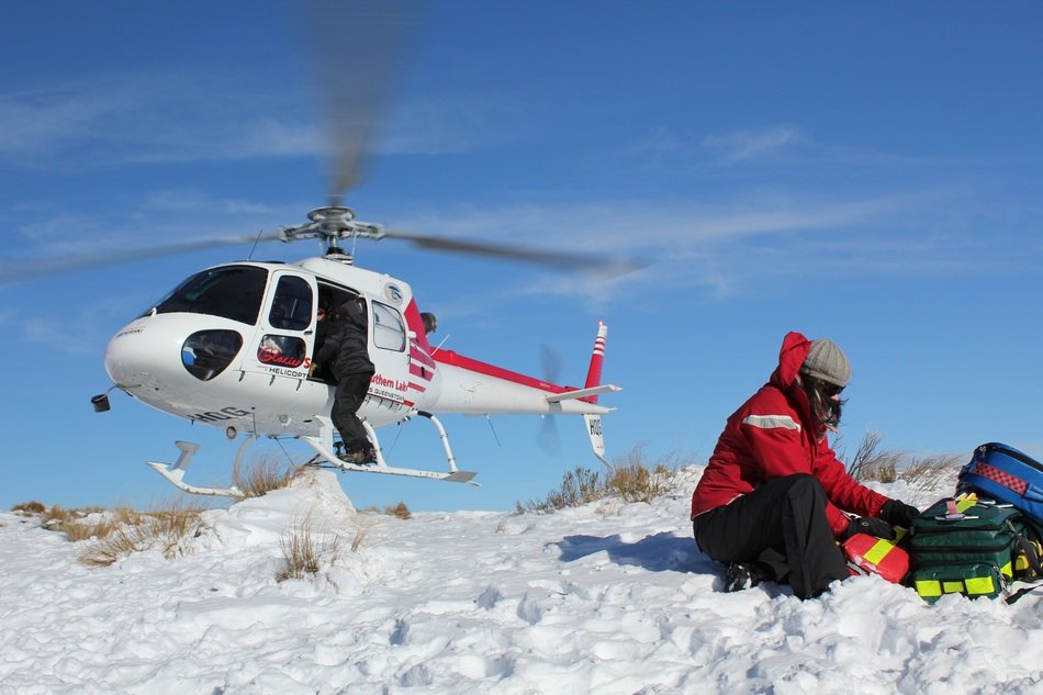 helicopter and lifeguard on the snow
