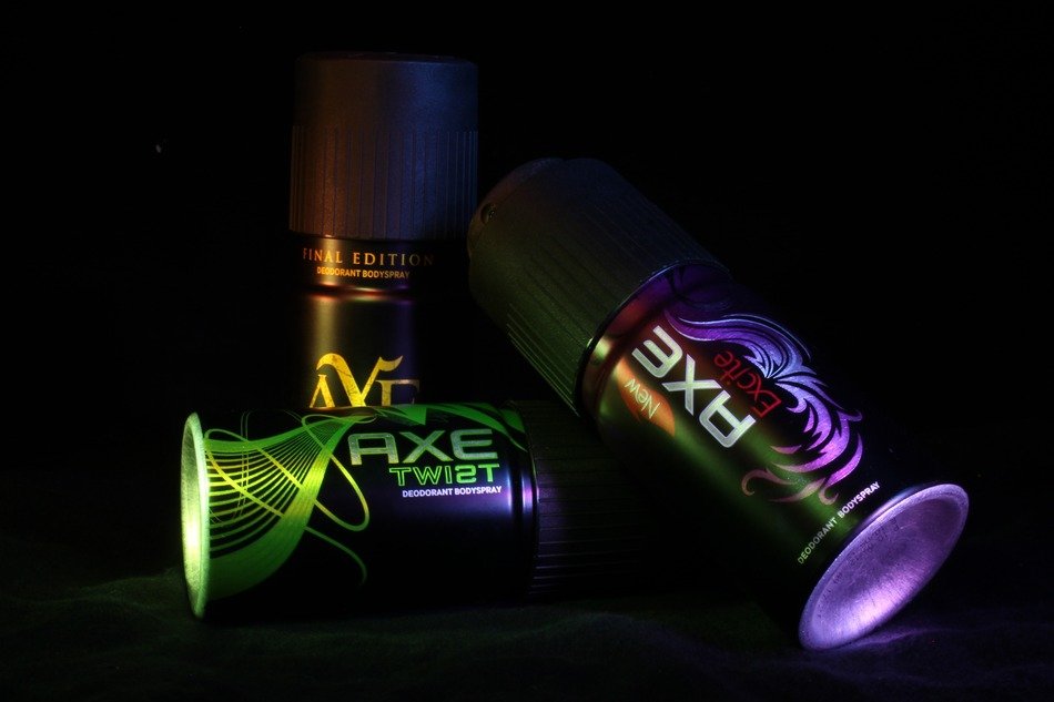spray jars on a black background