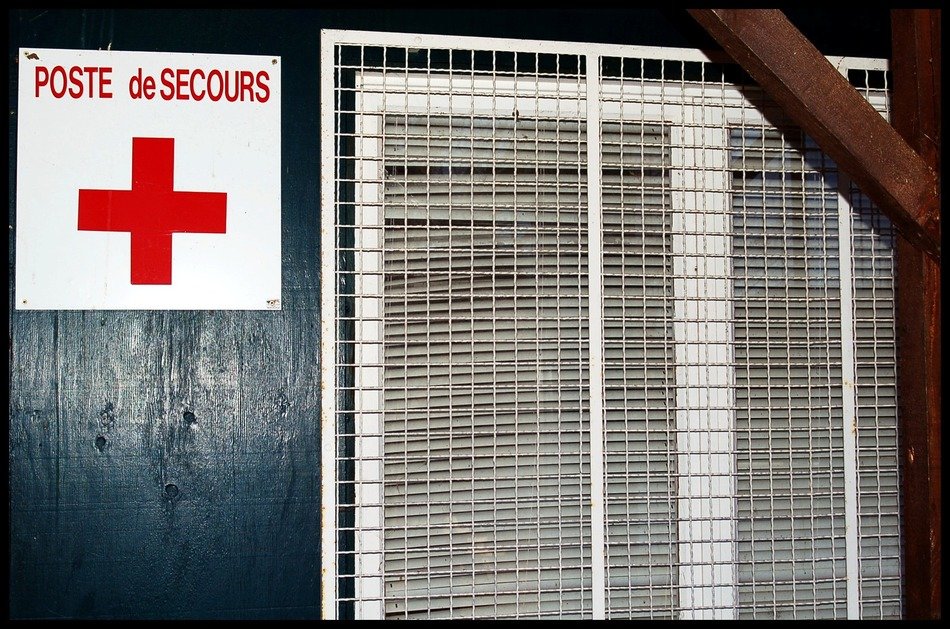 plate with a red cross on the wall