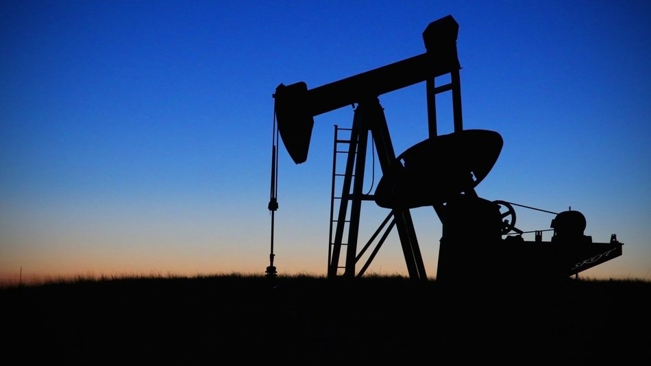 oil field silhouettes at dusk
