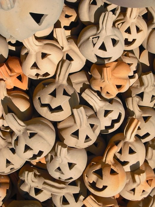 basket with ceramic figures in the form of pumpkins for halloween