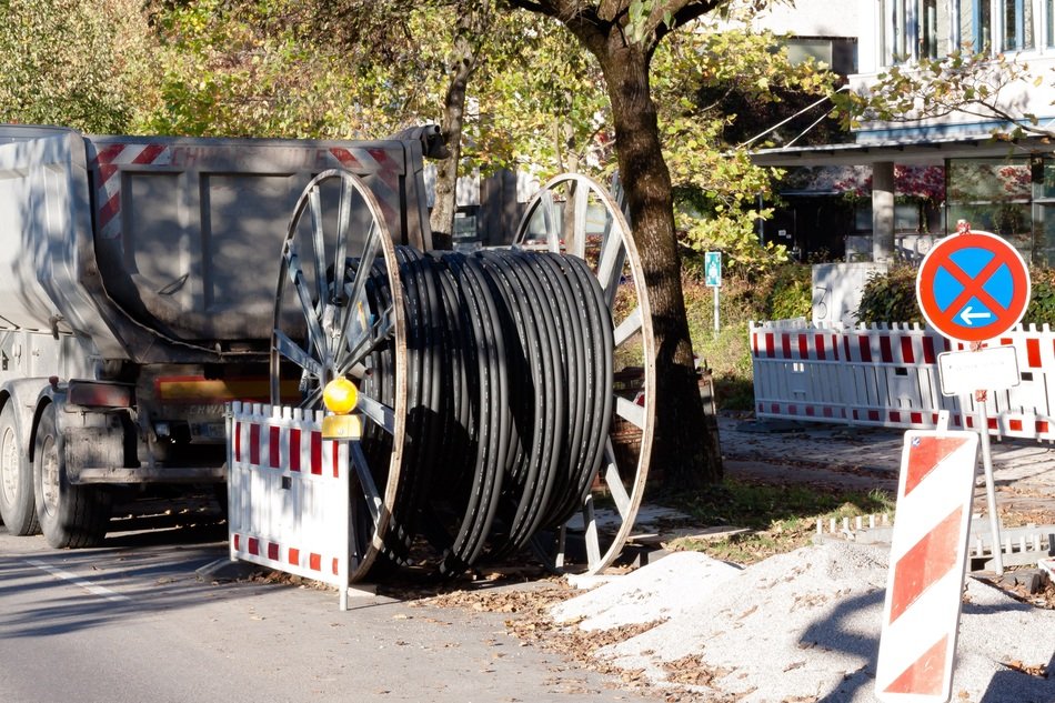 rolled plastic tube, fence and street sign, repair works