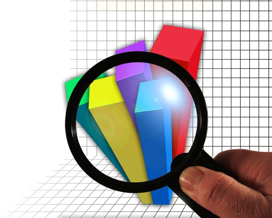 magnifying glass on check paper with chart