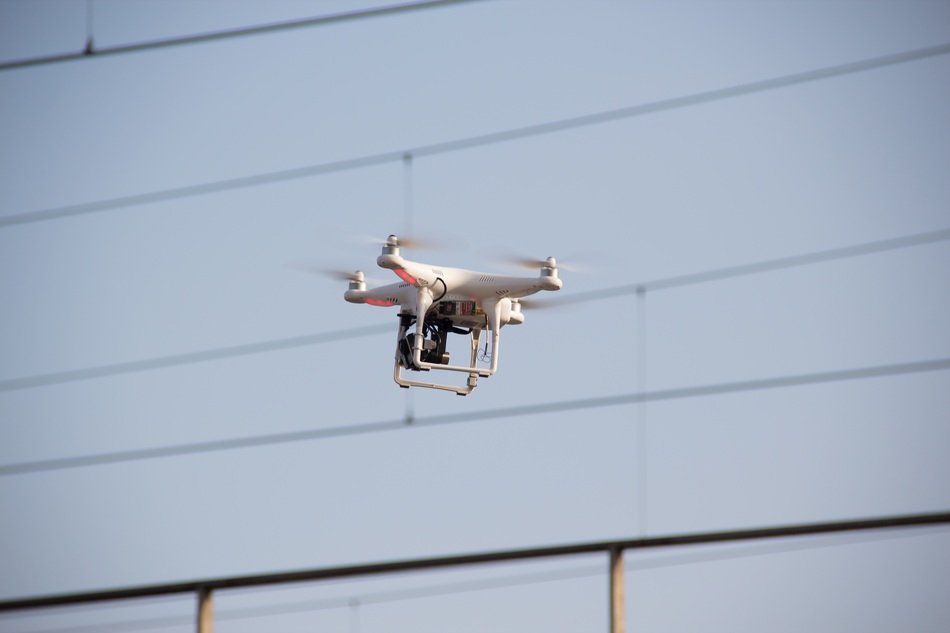 drone flies near the wall