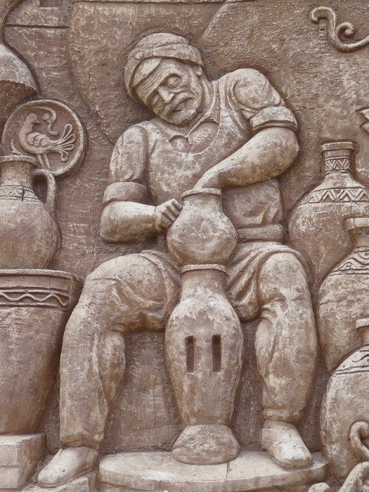 Wall relief in form of worker