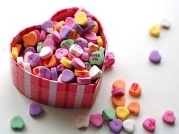 heart-shaped box with colored sweets