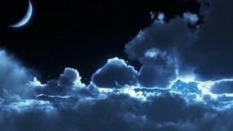 blue Clouds and moon in dark sky