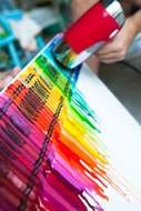 Melted Crayon Art, person works with blow dryer