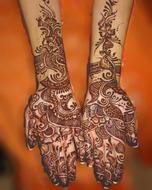 hands with indian henna drawings