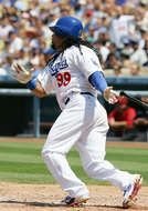 Manny Ramirez is a professional baseball player on the field