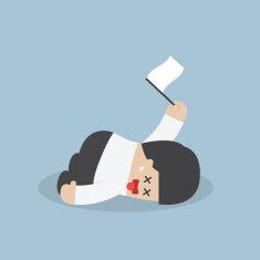 Exhausted businessman lying down on the floor and surrender