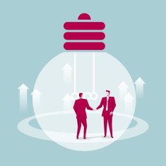 Two businessmen shaking hands in front of the lamp