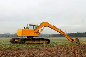 excavators on a field