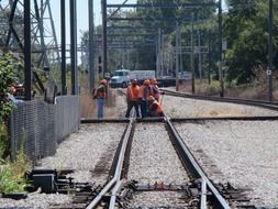 workers lay the rails