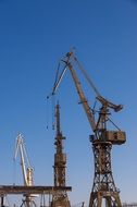 port cranes on the sky background