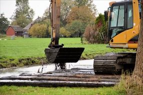 Dragging vehicle on a field