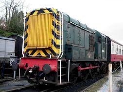 locomotive with carriage on rails