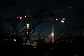 construction cranes at night