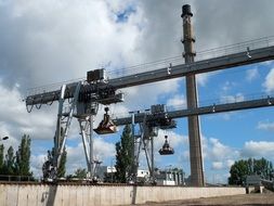 industrial cranes and excavators in the open air