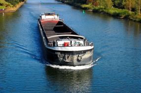 empty ship sailing along the canal