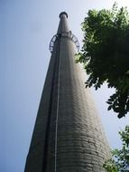 high brick smokestack at sky