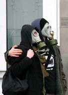 a couple of people in gas masks