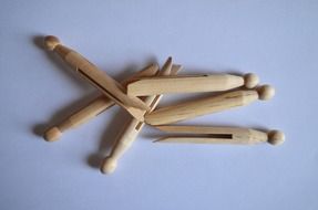clothespins for washing on a purple background