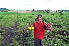 female farm worker with hoe