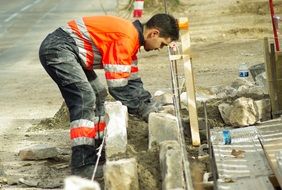 Worker is making a masonry