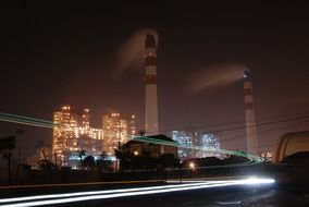 brightly lit factory at night