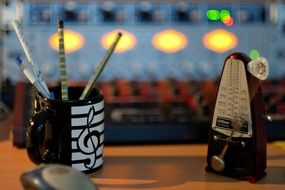 metronome and a cup