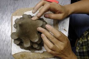 human hands sculpting