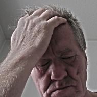old man having headache
