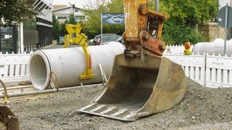 excavator with bucket at a construction site