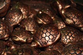 pile of metal tortoises, celestial animal in feng shui practice