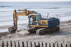 excavator on a beach