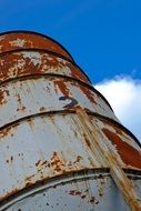 photo of a rusty industrial barrel