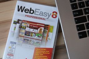 WebEasy8 Book and laptop on desk