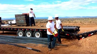 construction workers at truck