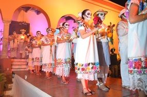 group of people in halloween costumes stand on stage