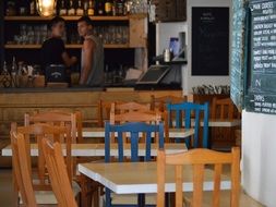 wooden tables and chairs in a cafe