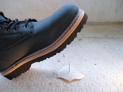 an accident in the form of a boot attacking a nail