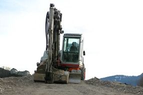 excavator with bucket and on tracks