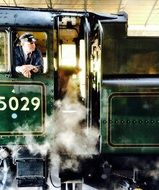 conductor in an antique locomotive