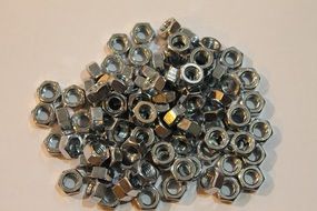 a bunch of metal nuts