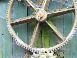 spiderweb on a iron mechanical mill wheel gear