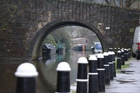 boats on canal at bridge