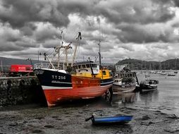 storm over fishing boats in scotland